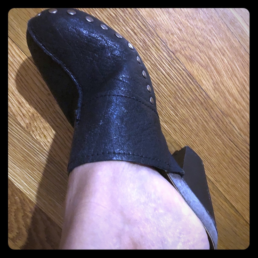 Black leather studded clogs